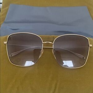 Gucci Women's Gold Frame Sunglasses with Dark Lenses